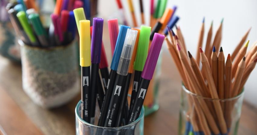 Tombow Dual Brush Pens arranged in a fan for adult coloring