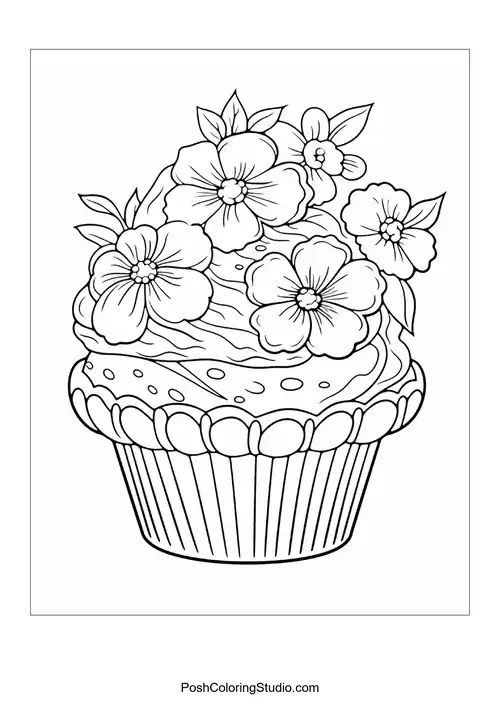 A cupcake with a flower and decorative leaves.
